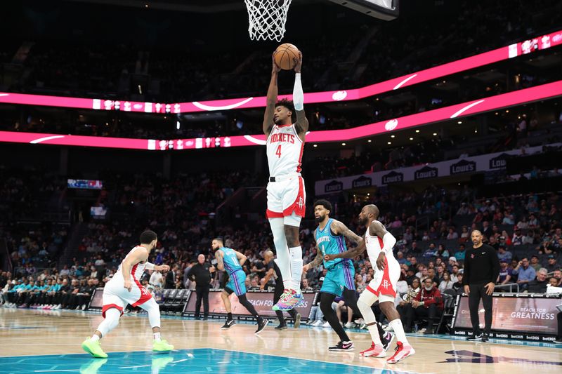 CHARLOTTE, NC - JANUARY 26:  Jalen Green #4 of the Houston Rockets grabs a rebound during the game against the Charlotte Hornets on January 26, 2024 at Spectrum Center in Charlotte, North Carolina. NOTE TO USER: User expressly acknowledges and agrees that, by downloading and or using this photograph, User is consenting to the terms and conditions of the Getty Images License Agreement.  Mandatory Copyright Notice:  Copyright 2024 NBAE (Photo by Brock Williams-Smith/NBAE via Getty Images)