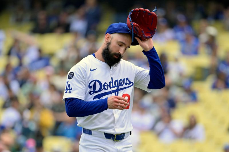 Apr 30, 2025; Los Angeles, California, USA; Los Angeles Dodgers starting pitcher Tony Gonsolin (26) reacts after a pitch against the Miami Marlins during the first inning at Dodger Stadium. Mandatory Credit: Jayne Kamin-Oncea-Imagn Images