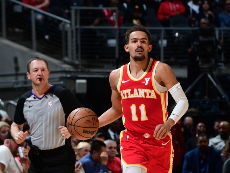 ATLANTA, GA - FEBRUARY 2: Trae Young #11 of the Atlanta Hawks dribbles the ball during the game against the Phoenix Suns on February 2, 2024 at State Farm Arena in Atlanta, Georgia.  NOTE TO USER: User expressly acknowledges and agrees that, by downloading and/or using this Photograph, user is consenting to the terms and conditions of the Getty Images License Agreement. Mandatory Copyright Notice: Copyright 2024 NBAE (Photo by Scott Cunningham/NBAE via Getty Images)