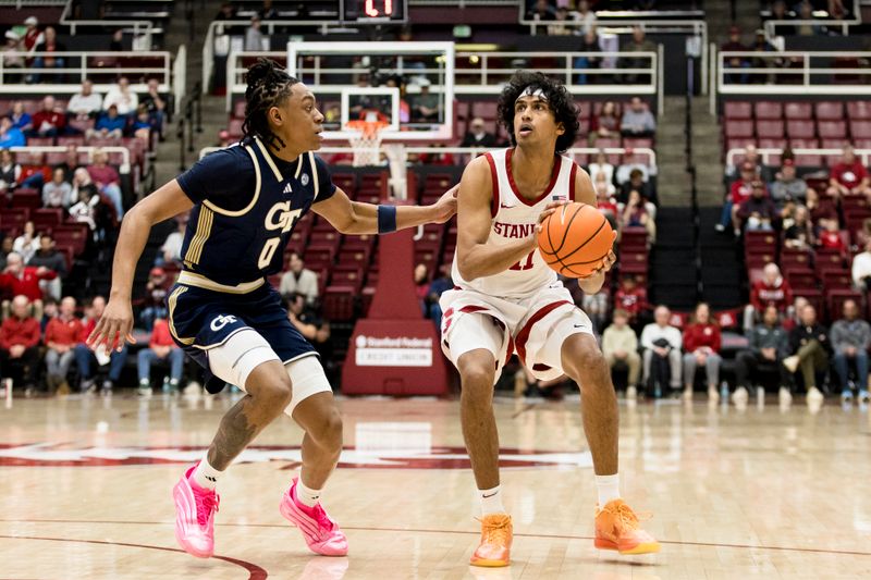 Feb 7, 2026; Stanford, California, USA;  Georgia Tech Yellow Jackets guard Akai Fleming (0) defends Stanford Cardinal guard Ryan Agarwal (11) during the first half at Maples Pavilion. Mandatory Credit: John Hefti-Imagn Images