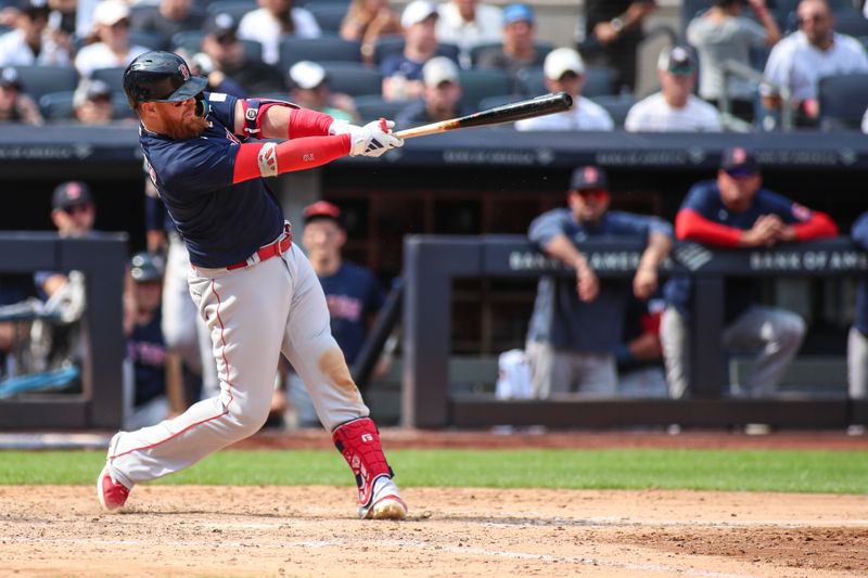 Aug 20, 2023; Bronx, New York, USA;  Boston Red Sox first baseman Justin Turner (2) hits a three-run home run in the seventh inning against the New York Yankees at Yankee Stadium. Mandatory Credit: Wendell Cruz-USA TODAY Sports