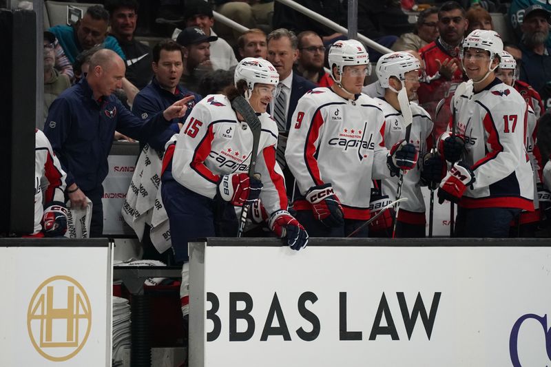 Dec 3, 2025; San Jose, California, USA;  Washington Capitals left winger Sonny Milano (15) returns to the bench after scoring a goal as right winger Ryan Leonard (9) and center Dylan Strome (17) look on against the San Jose Sharks in the first period at SAP Center at San Jose. Mandatory Credit: David Gonzales-Imagn Images