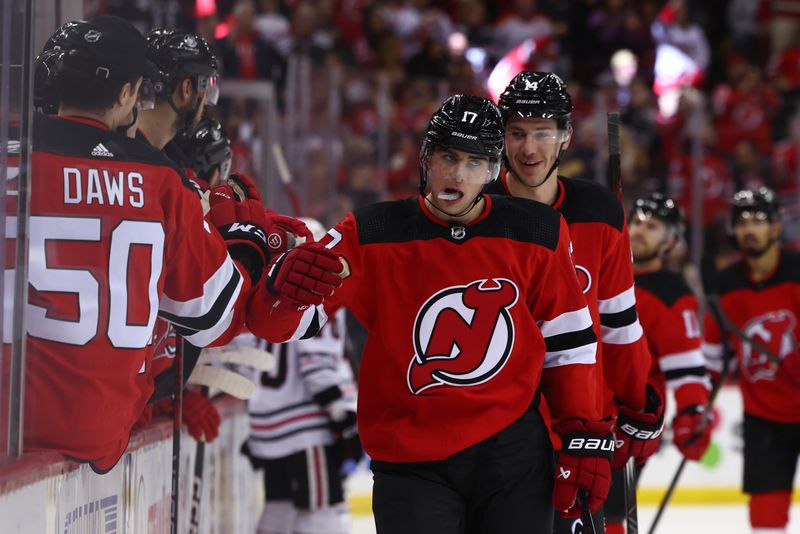 Jan 5, 2024; Newark, New Jersey, USA; New Jersey Devils defenseman Simon Nemec (17) celebrates his goal against the Chicago Blackhawks during the third period at Prudential Center. Mandatory Credit: Ed Mulholland-USA TODAY Sports