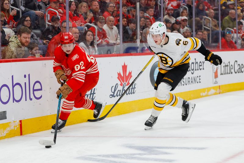 Mar 21, 2026; Detroit, Michigan, USA; Detroit Red Wings center Marco Kasper (92) handles the puck against Boston Bruins defenseman Mason Lohrei (6) during the second period at Little Caesars Arena. Mandatory Credit: Brian Bradshaw Sevald-Imagn Images Mar 21, 2026; Detroit, Michigan, USA; Detroit Red Wings center Marco Kasper (92) handles the puck against Boston Bruins defenseman Mason Lohrei (6) during the second period at Little Caesars Arena. Mandatory Credit: Brian Bradshaw Sevald-Imagn Images