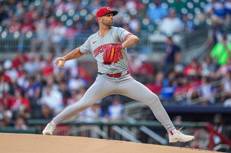 Sep 9, 2024; Cumberland, Georgia, USA; Cincinnati Reds starting pitcher Nick Martinez (28) pitches against the Atlanta Braves during the first inning at Truist Park. Mandatory Credit: Dale Zanine-Imagn Images