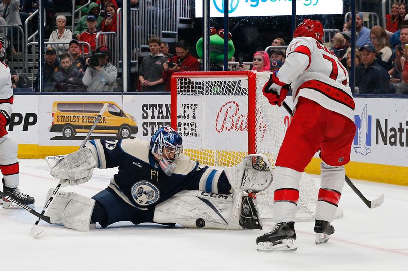 Apr 16, 2024; Columbus, Ohio, USA; Columbus Blue Jackets goalie Jet Greaves (73) makes a save on a shot by Carolina Hurricanes defenseman Tony DeAngelo (77) during the third period at Nationwide Arena. Mandatory Credit: Russell LaBounty-USA TODAY Sports