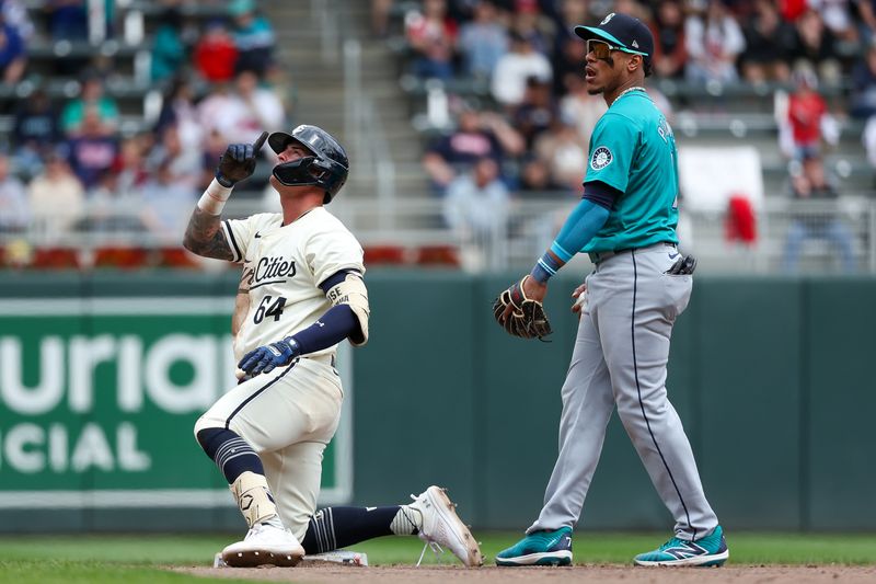 May 9, 2024; Minneapolis, Minnesota, USA; Minnesota Twins Jose Miranda (64) celebrates his double against the Seattle Mariners during the fifth inning at Target Field. Mandatory Credit: Matt Krohn-USA TODAY Sports