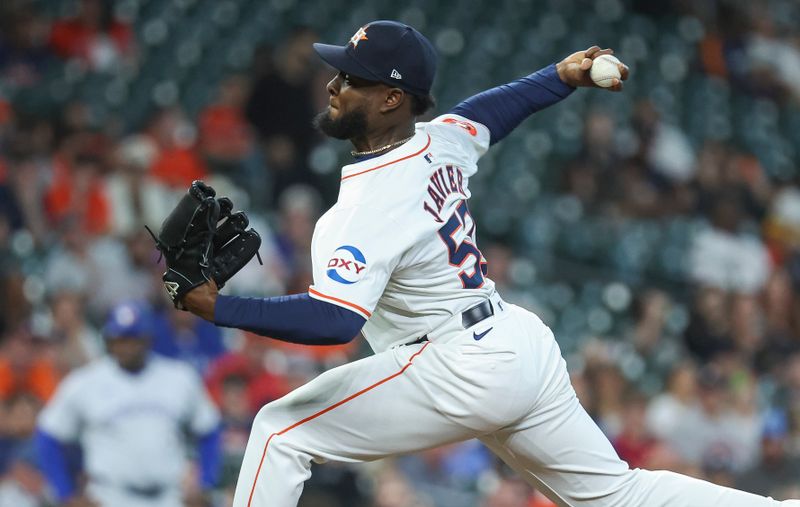Apr 3, 2024; Houston, Texas, USA; Houston Astros starting pitcher Cristian Javier (53) delivers a pitch during the first inning against the Toronto Blue Jays at Minute Maid Park. Mandatory Credit: Troy Taormina-USA TODAY Sports