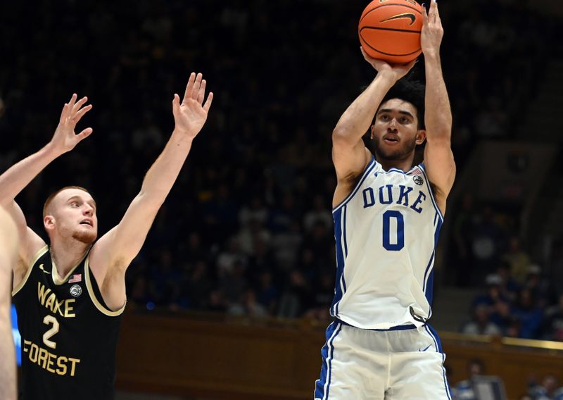 Feb 12, 2024; Durham, North Carolina, USA;  Duke Blue Devils guard Jared McCain (0) shoots in front of Wake Forest Deamon Deacons guard Cameron Hildreth (2) during the second half at Cameron Indoor Stadium. The Blue Devils won 77-69. Mandatory Credit: Rob Kinnan-USA TODAY Sports