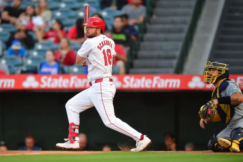 Jun 18, 2024; Anaheim, California, USA; Los Angeles Angels first base Nolan Schanuel (18) hits a double against the Milwaukee Brewers during the third inning at Angel Stadium. Mandatory Credit: Gary A. Vasquez-USA TODAY Sports
