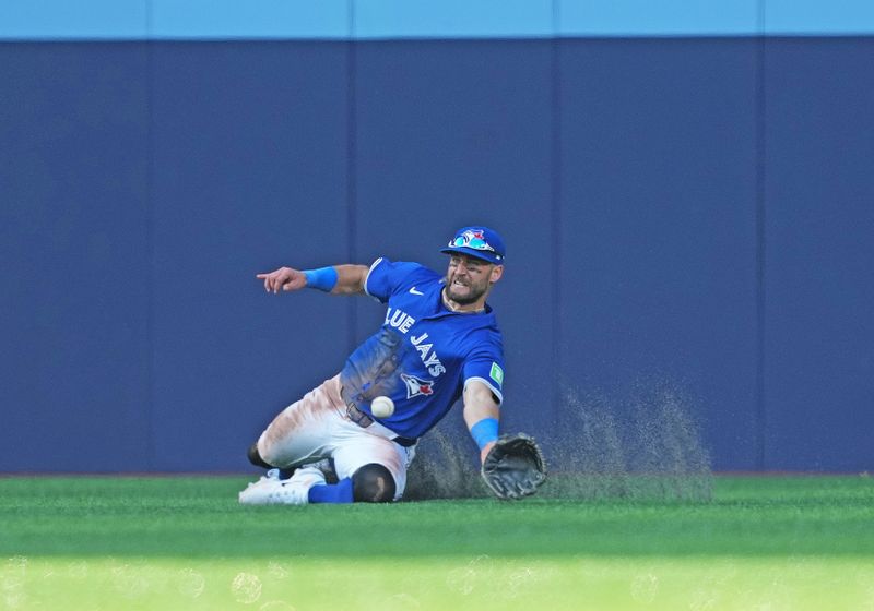 May 20, 2024; Toronto, Ontario, CAN; Toronto Blue Jays centre fielder Kevin Kiermaier (39) catches a fly ball for the final out against the Chicago White Sox during the ninth inning at Rogers Centre. Mandatory Credit: Nick Turchiaro-USA TODAY Sports