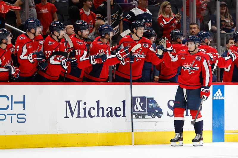 Sep 22, 2024; Washington, District of Columbia, USA; Washington Capitals forward Ivan Miroshnichenko (63) celebrates with teammates after scoring a goal against the Philadelphia Flyers in the second period at Capital One Arena. Mandatory Credit: Geoff Burke-Imagn Images