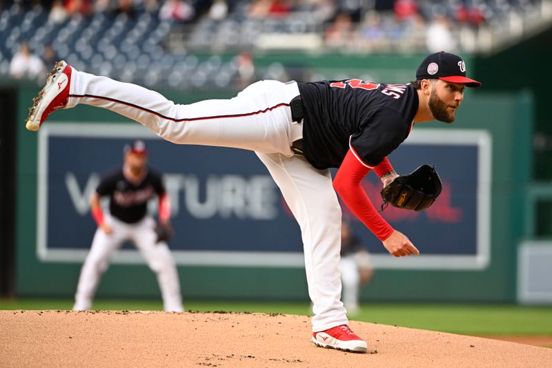 May 22, 2025; Washington, District of Columbia, USA; Washington Nationals pitcher Trevor Williams (32) throws to the Atlanta Braves during the first inning at Nationals Park. Mandatory Credit: Brad Mills-Imagn Images