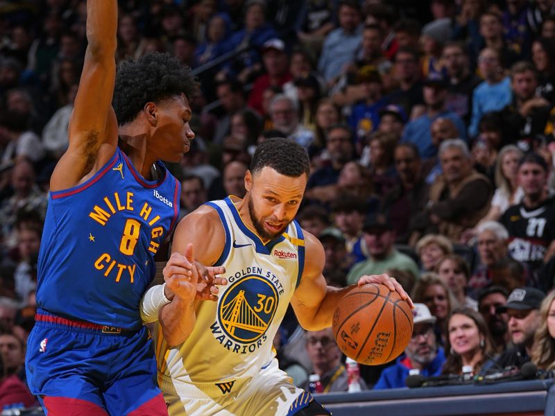 DENVER, CO -DECEMBER 03:  Stephen Curry #30 of the Golden State Warriors handles the ball during the game against the Denver Nuggets during the Emirates NBA Cup game on December 03, 2024 at Ball Arena in Denver, Colorado. NOTE TO USER: User expressly acknowledges and agrees that, by downloading and/or using this Photograph, user is consenting to the terms and conditions of the Getty Images License Agreement. Mandatory Copyright Notice: Copyright 2024 NBAE (Photo by Bart Young/NBAE via Getty Images)