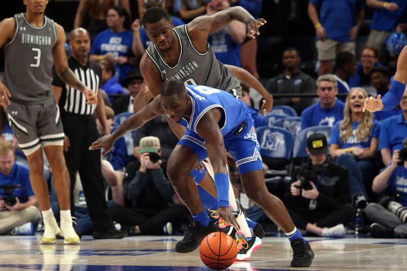 Mar 3, 2024; Memphis, Tennessee, USA; Memphis Tigers forward David Jones (8) steals the ball from UAB Blazers forward Javian Davis (0) during the first half at FedExForum. Mandatory Credit: Petre Thomas-USA TODAY Sports