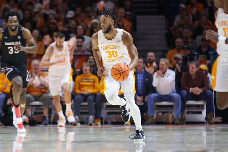 Feb 25, 2023; Knoxville, Tennessee, USA; Tennessee Volunteers guard Josiah-Jordan James (30) brings the ball up court against the South Carolina Gamecocks during the first half at Thompson-Boling Arena. Mandatory Credit: Randy Sartin-USA TODAY Sports