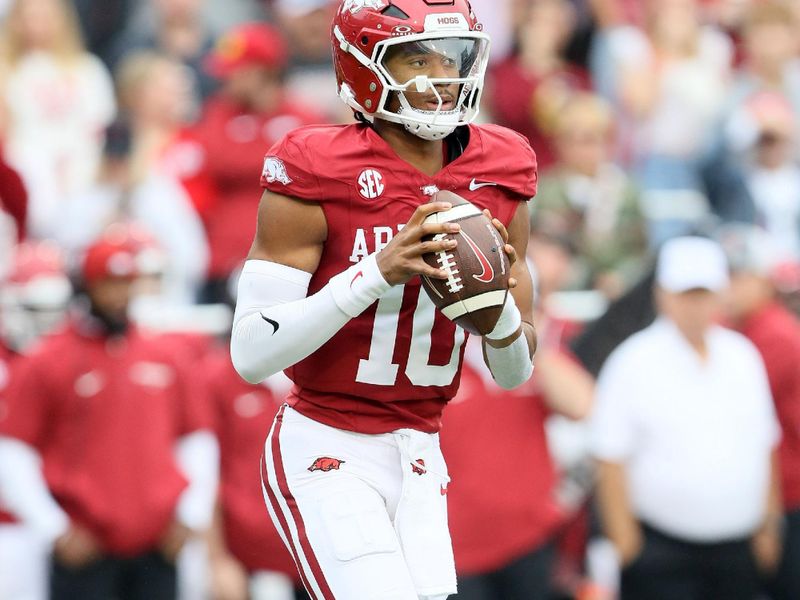 Nov 2, 2024; Fayetteville, Arkansas, USA; Arkansas Razorbacks quarterback Taylen Green (10) looks to pass in the first quarter against the Ole Miss Rebels at Donald W. Reynolds Razorback Stadium. Mandatory Credit: Nelson Chenault-Imagn Images