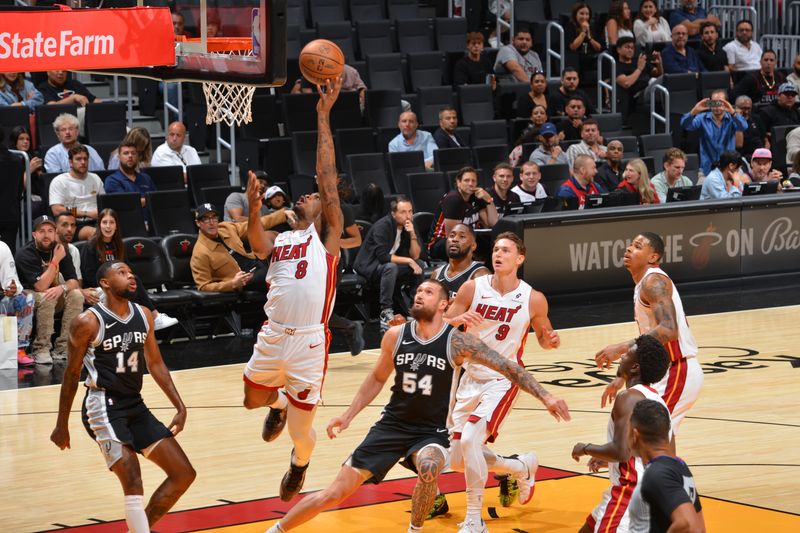 MIAMI, FL - OCTOBER 15: Josh Christopher #8 of the Miami Heat drives to the basket during the game against the San Antonio Spurs during a NBA preseason game on October 15, 2024 at Kaseya Center in Miami, Florida. NOTE TO USER: User expressly acknowledges and agrees that, by downloading and or using this Photograph, user is consenting to the terms and conditions of the Getty Images License Agreement. Mandatory Copyright Notice: Copyright 2024 NBAE (Photo by Jesse D. Garrabrant/NBAE via Getty Images)