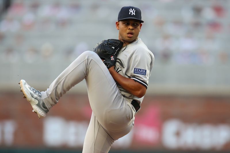 Aug 16, 2023; Atlanta, Georgia, USA; New York Yankees starting pitcher Randy Vasquez (98) throws against the Atlanta Braves in the first inning at Truist Park. Mandatory Credit: Brett Davis-USA TODAY Sports