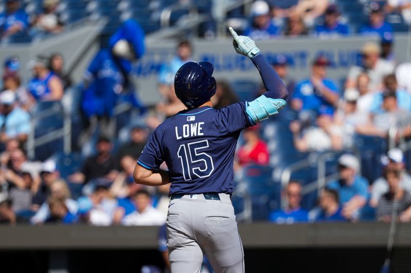May 15, 2025; Toronto, Ontario, CAN; Tampa Bay Rays second base Josh Lowe (15) crosses home plate after hitting a home run against the Toronto Blue Jays during the fifth inning at Rogers Centre. Mandatory Credit: Kevin Sousa-Imagn Images