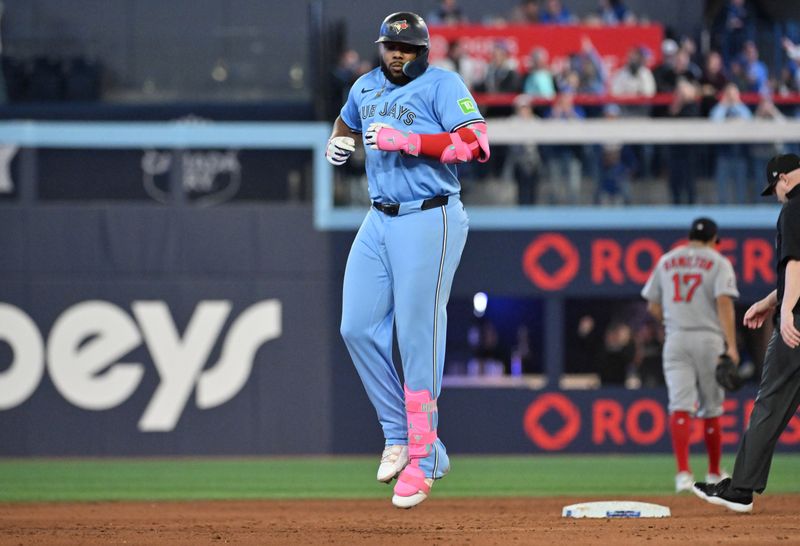 May 1, 2025; Toronto, Ontario, CAN;  Toronto Blue Jays first baseman Vladimir Guerrero Jr. (27) runs the bases after hitting a three run home run against the Boston Red Sox in the eighth inning at Rogers Centre. Mandatory Credit: Dan Hamilton-Imagn Images