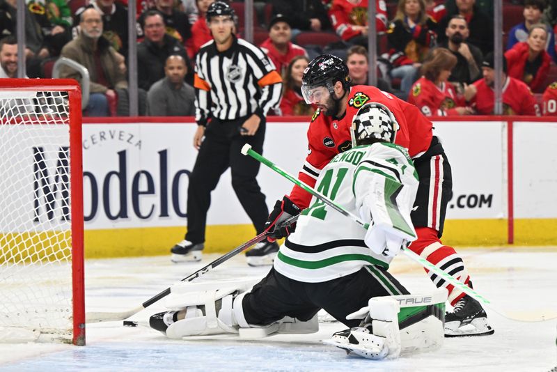 Jan 13, 2024; Chicago, Illinois, USA;  Chicago Blackhawks forward Colin Blackwell (43) skates past Dallas Stars goaltender Scott Wedgewood (41) with the puck in the first period at United Center. Mandatory Credit: Jamie Sabau-USA TODAY Sports