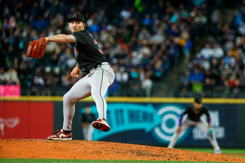 Apr 28, 2024; Seattle, Washington, USA; Arizona Diamondbacks starting pitcher Brandon Pfaadt (32) throws against the Seattle Mariners during the fourth inning at T-Mobile Park. Mandatory Credit: Joe Nicholson-USA TODAY Sports