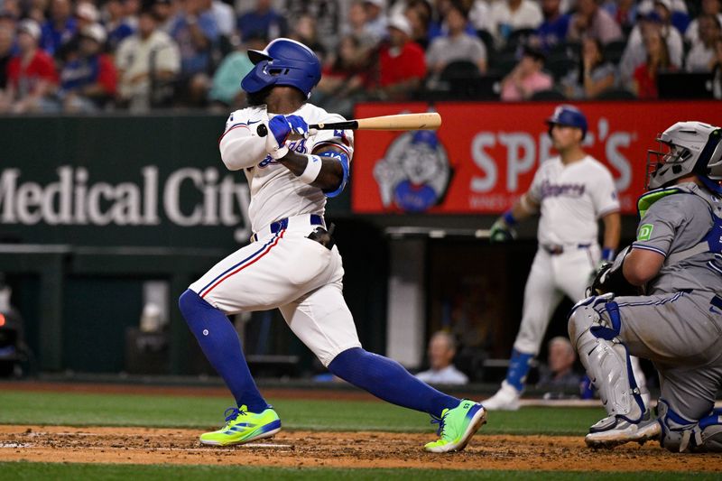 Sep 17, 2024; Arlington, Texas, USA; Texas Rangers right fielder Adolis Garcia (53) hits a single and drives in a run against the Toronto Blue Jays during the fourth inning at Globe Life Field. Mandatory Credit: Jerome Miron-Imagn Images