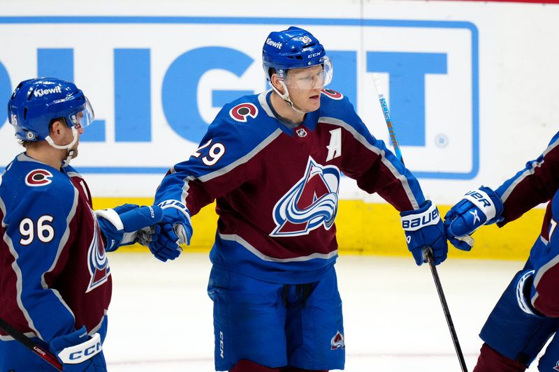 Mar 26, 2024; Denver, Colorado, USA; Colorado Avalanche center Nathan MacKinnon (29) celebrates his goal with right wing Mikko Rantanen (96) in the first period at Ball Arena. Mandatory Credit: Ron Chenoy-USA TODAY Sports