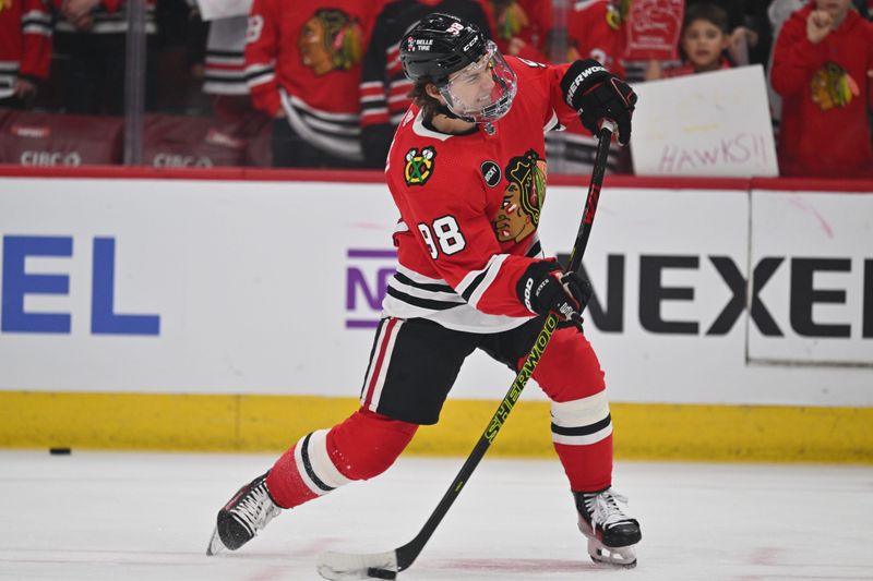 Apr 12, 2024; Chicago, Illinois, USA; Chicago Blackhawks forward Connor Bedard (98) warms up before a game against the Nashville Predators at United Center. Mandatory Credit: Jamie Sabau-USA TODAY Sports