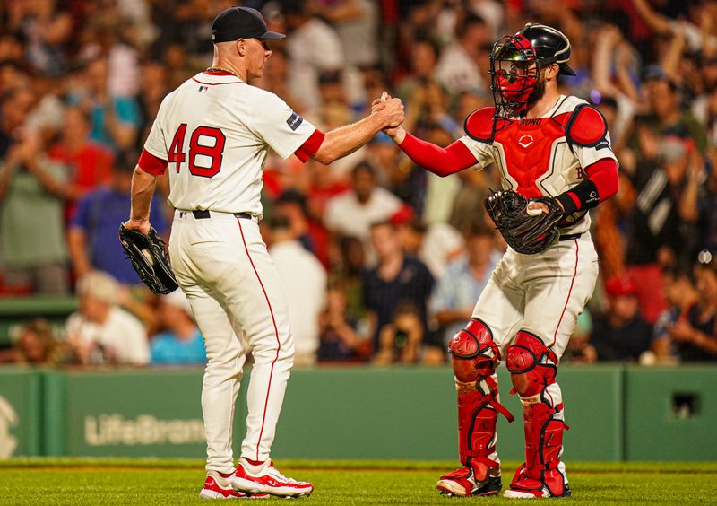 Jul 11, 2024; Boston, Massachusetts, USA; Boston Red Sox relief pitcher Chase Anderson (48) and catcher Connor Wong (12) reacts after defeating the Oakland Athletics in nine innings at Fenway Park. Mandatory Credit: David Butler II-USA TODAY Sports