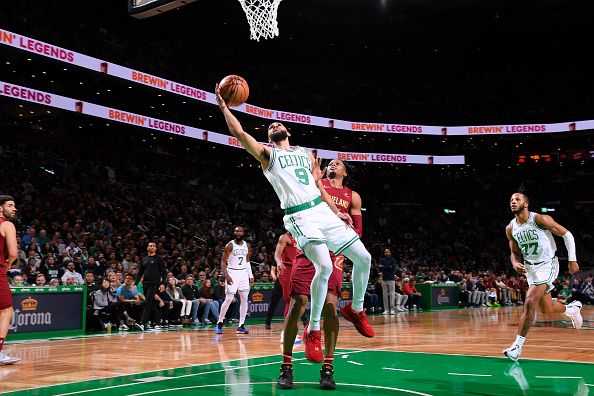 BOSTON, MA - DECEMBER 14: Derrick White #9 of the Boston Celtics shoots the ball during the game against the Cleveland Cavaliers on December 14, 2023 at the TD Garden in Boston, Massachusetts. NOTE TO USER: User expressly acknowledges and agrees that, by downloading and or using this photograph, User is consenting to the terms and conditions of the Getty Images License Agreement. Mandatory Copyright Notice: Copyright 2023 NBAE  (Photo by Brian Babineau/NBAE via Getty Images)