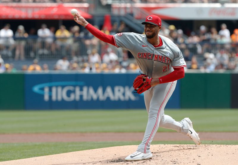 Jun 19, 2024; Pittsburgh, Pennsylvania, USA;  Cincinnati Reds starting pitcher Hunter Greene (21) delivers a pitch against the Pittsburgh Pirates during the first inning at PNC Park. Mandatory Credit: Charles LeClaire-USA TODAY Sports