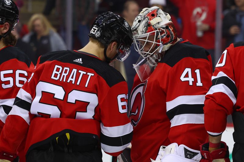 Jan 5, 2024; Newark, New Jersey, USA; New Jersey Devils left wing Jesper Bratt (63) and New Jersey Devils goaltender Vitek Vanecek (41) celebrate the Devils win over the Chicago Blackhawks at Prudential Center. Mandatory Credit: Ed Mulholland-USA TODAY Sports