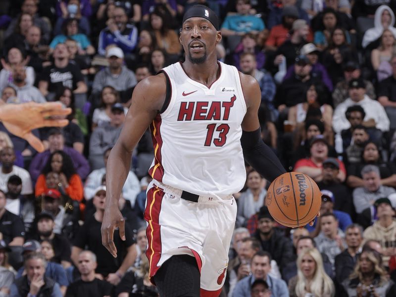 SACRAMENTO, CA - FEBRUARY 26: Bam Adebayo #13 of the Miami Heat dribbles the ball during the game against the Sacramento Kings on February 26, 2024 at Golden 1 Center in Sacramento, California. NOTE TO USER: User expressly acknowledges and agrees that, by downloading and or using this Photograph, user is consenting to the terms and conditions of the Getty Images License Agreement. Mandatory Copyright Notice: Copyright 2024 NBAE (Photo by Rocky Widner/NBAE via Getty Images)