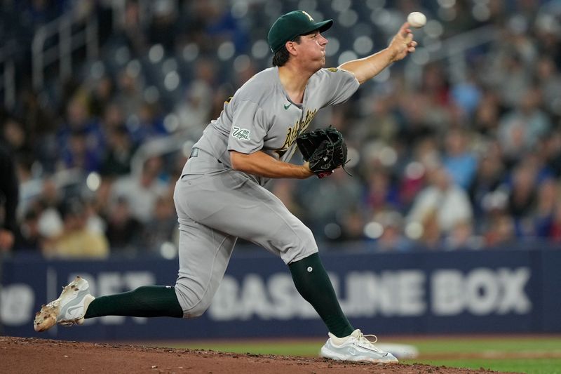 May 29, 2025; Toronto, Ontario, CAN; Athletics starting pitcher Jacob Lopez (57) pitches to the Toronto Blue Jays during the second inning at Rogers Centre. Mandatory Credit: John E. Sokolowski-Imagn Images