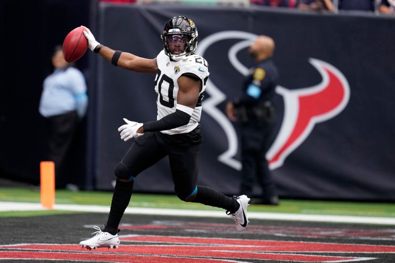 Jacksonville Jaguars safety Daniel Thomas (20) celebrates after recovering a fumbled punt during the first half of an NFL football game against the Houston Texans, Sunday, Sept. 29, 2024, in Houston. (AP Photo/Eric Christian Smith)