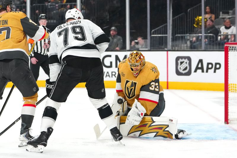 Feb 5, 2026; Las Vegas, Nevada, USA; Vegas Golden Knights goaltender Adin Hill (33) makes a save as Los Angeles Kings center Samuel Helenius (79) looks for the rebound during the first period at T-Mobile Arena. Mandatory Credit: Stephen R. Sylvanie-Imagn Images