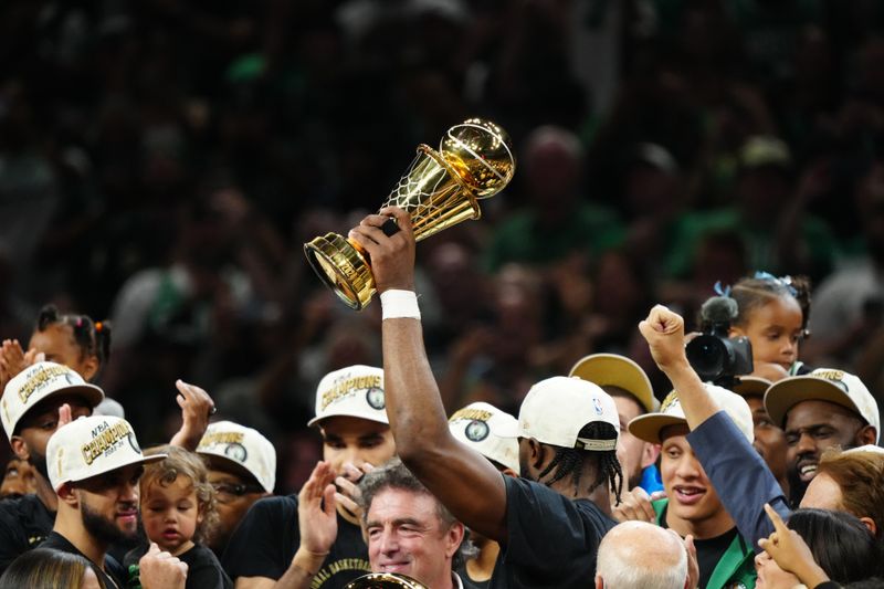 BOSTON, MA - JUNE 17: Jaylen Brown poses with The Bill Russell Finals MVP Trophy after the game against the Dallas Mavericks during Game 5 of the 2024 NBA Finals on June 17, 2024 at the TD Garden in Boston, Massachusetts. NOTE TO USER: User expressly acknowledges and agrees that, by downloading and or using this photograph, User is consenting to the terms and conditions of the Getty Images License Agreement. Mandatory Copyright Notice: Copyright 2024 NBAE  (Photo by Garrett Ellwood/NBAE via Getty Images)