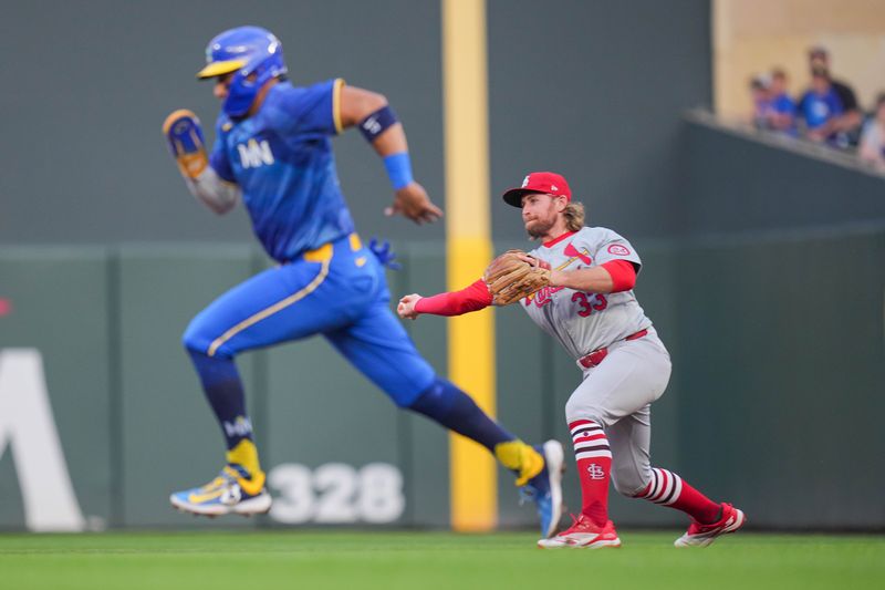 Aug 23, 2024; Minneapolis, Minnesota, USA; St. Louis Cardinals second base Brendan Donovan (33) throws to second base for the out against the Minnesota Twins third base Royce Lewis (23) in the first inning at Target Field. Mandatory Credit: Brad Rempel-USA TODAY Sports