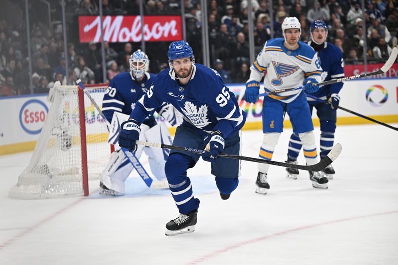 Nov 18, 2025; Toronto, Ontario, CAN;  Toronto Maple Leafs defenseman Oliver Ekman-Larsson (95) pursues the play against the St. Louis Blues in the second period at Scotiabank Arena. Mandatory Credit: Dan Hamilton-Imagn Images