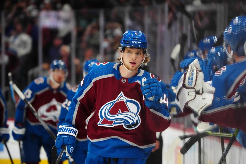 Oct 21, 2022; Denver, Colorado, USA; Colorado Avalanche defenseman Bowen Byram (4) celebrates a short handed goal in the third period against the Seattle Kraken at Ball Arena. Mandatory Credit: Ron Chenoy-USA TODAY Sports