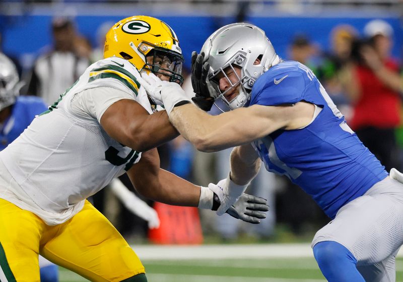 Detroit Lions defensive end Aidan Hutchinson, right, goes up against Green Bay Packers guard Zach Tom during the second half of an NFL football game Sunday, Nov. 23, 2023, in Detroit. (AP Photo/Duane Burleson)