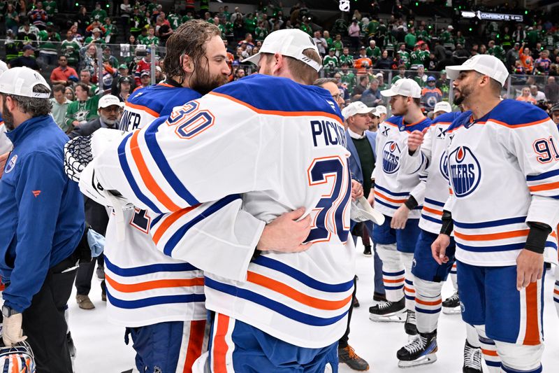 May 29, 2025; Dallas, Texas, USA; Edmonton Oilers goaltender Stuart Skinner (74) reacts with goaltender Calvin Pickard (30)  after defeating the Dallas Stars in game five of the Western Conference Final of the 2025 Stanley Cup Playoffs at American Airlines Center. Mandatory Credit: Jerome Miron-Imagn Images