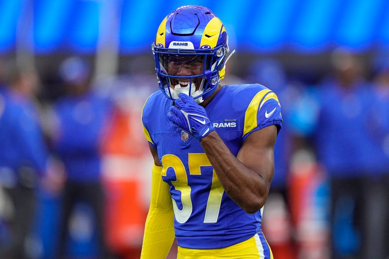 Los Angeles Rams safety Quentin Lake smiles on the field during the first half of a preseason NFL football game against the Los Angeles Chargers Saturday, Aug. 12, 2023, in Inglewood, Calif. (AP Photo/Mark J. Terrill)