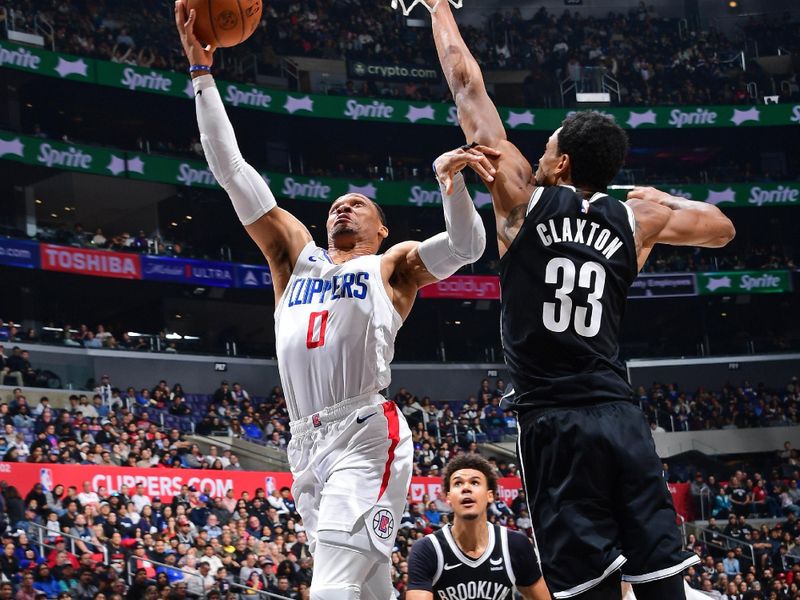 LOS ANGELES, CA - JANUARY 21: Russell Westbrook #0 of the LA Clippers drives to the basket during the game against the Brooklyn Nets on January 21, 2024 at Crypto.Com Arena in Los Angeles, California. NOTE TO USER: User expressly acknowledges and agrees that, by downloading and/or using this Photograph, user is consenting to the terms and conditions of the Getty Images License Agreement. Mandatory Copyright Notice: Copyright 2024 NBAE (Photo by Adam Pantozzi/NBAE via Getty Images)