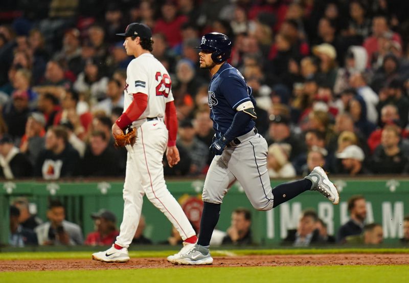 Sep 26, 2023; Boston, Massachusetts, USA; Tampa Bay Rays catcher Rene Pinto (50) hits a home run against the Boston Red Sox in the third inning at Fenway Park. Mandatory Credit: David Butler II-USA TODAY Sports