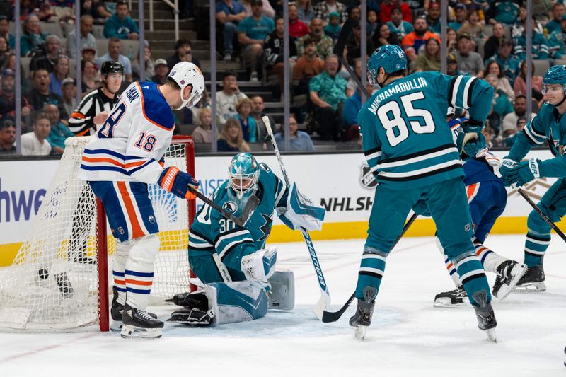 Feb 28, 2026; San Jose, California, USA; Edmonton Oilers left wing Zach Hyman (18) scores a goal against San Jose Sharks goaltender Yaroslav Askarov (30) during the first period at SAP Center at San Jose. Mandatory Credit: Neville E. Guard-Imagn Images
