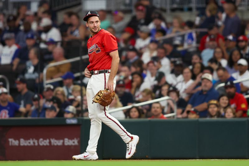 Sep 6, 2024; Atlanta, Georgia, USA; Atlanta Braves first baseman Matt Olson (28) reacts after diving for a foul ball against the Toronto Blue Jays in the fifth inning at Truist Park. Mandatory Credit: Brett Davis-Imagn Images
