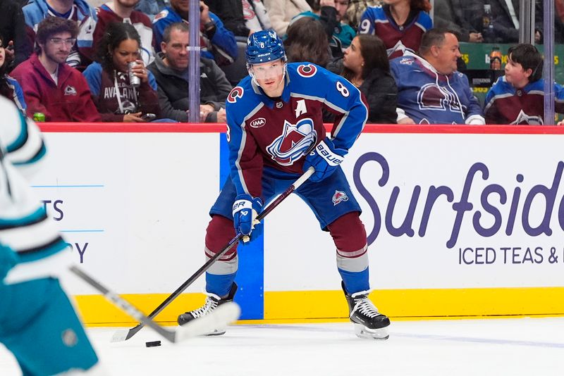 Nov 26, 2025; Denver, Colorado, USA; Colorado Avalanche defenseman Cale Makar (8) controls the puck in the second period against the San Jose Sharks at Ball Arena. Mandatory Credit: Ron Chenoy-Imagn Images